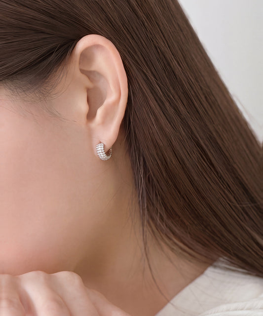 Pavé Lab Grown Diamond Ribbed Huggie Hoop Earrings in White Gold worn, profile with hair back