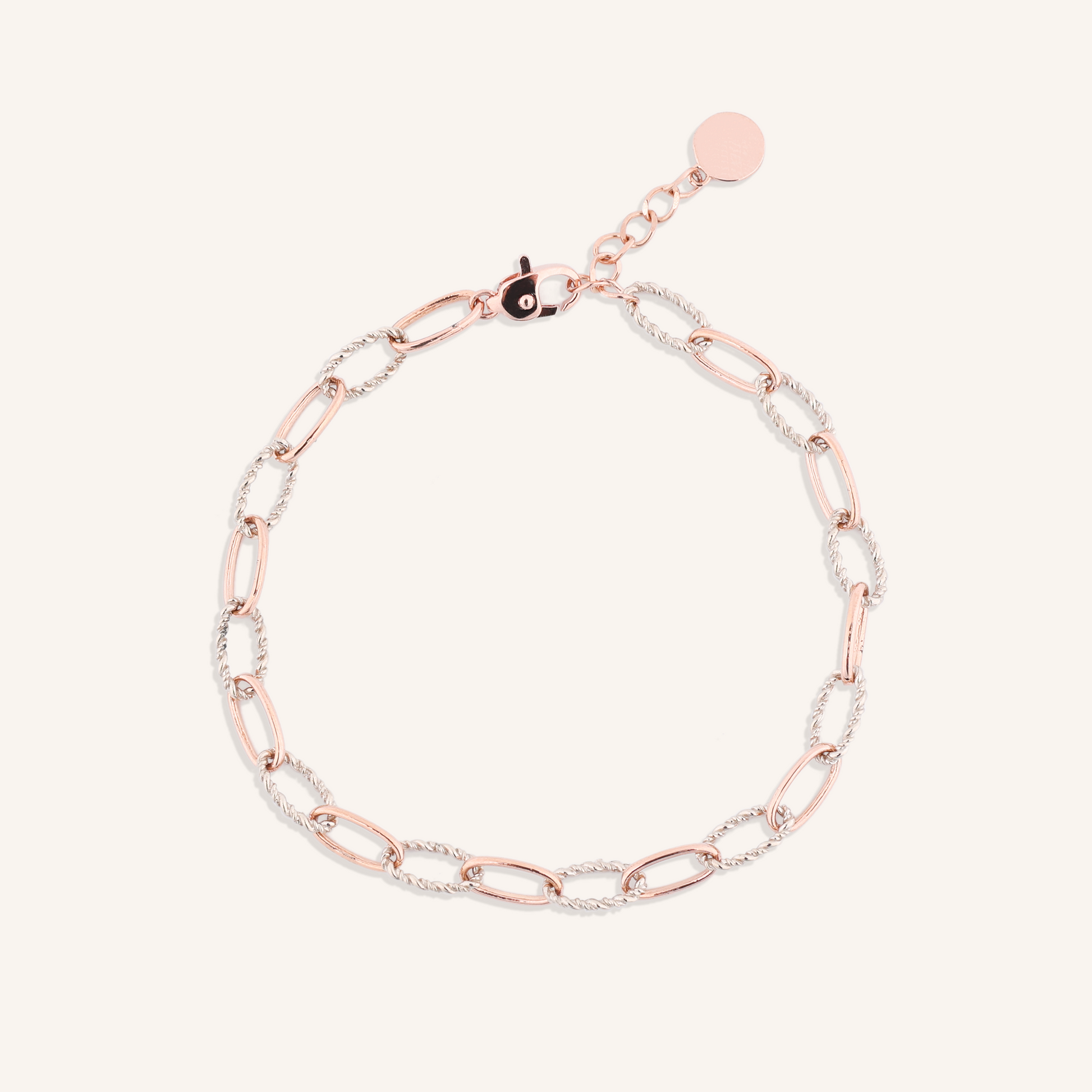 Two-tone rose gold and silver chain bracelet on a white background