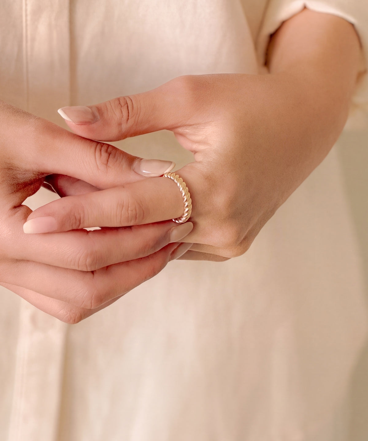 Brioche Ring on clasped hands