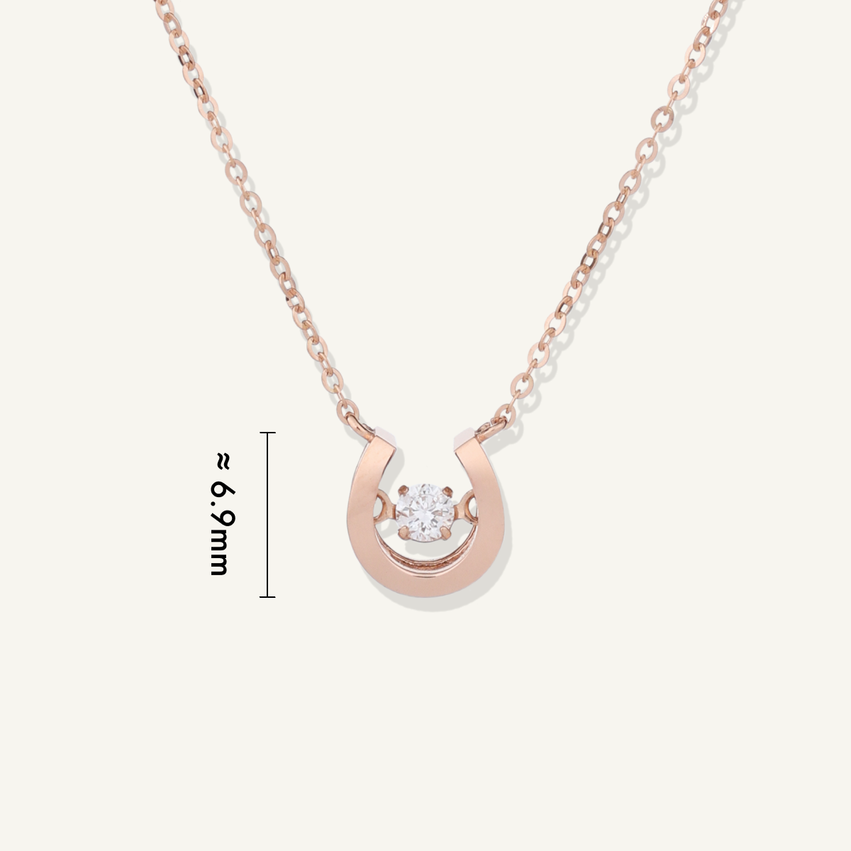Rose Gold | shot 5 | Rose gold horseshoe necklace with diamond on a white background