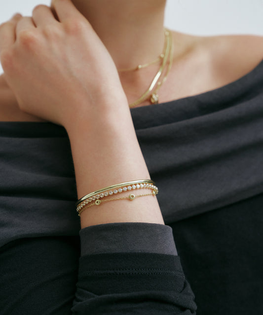 Yellow Gold | Lab Grown Diamond Bezel Tennis Bracelet, worn, hand at the neck