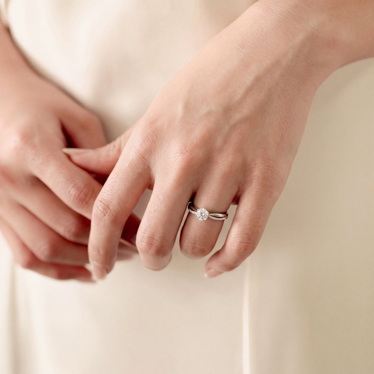 Solitaire engagement ring with hand-selected pavé diamonds