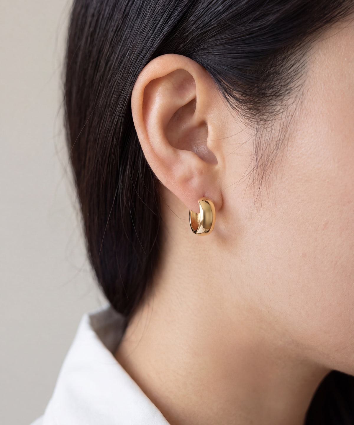 Yellow Gold | Wide Dome Hoop Earrings, worn | Wide Dome Hoop Earrings in yellow gold worn on the ear